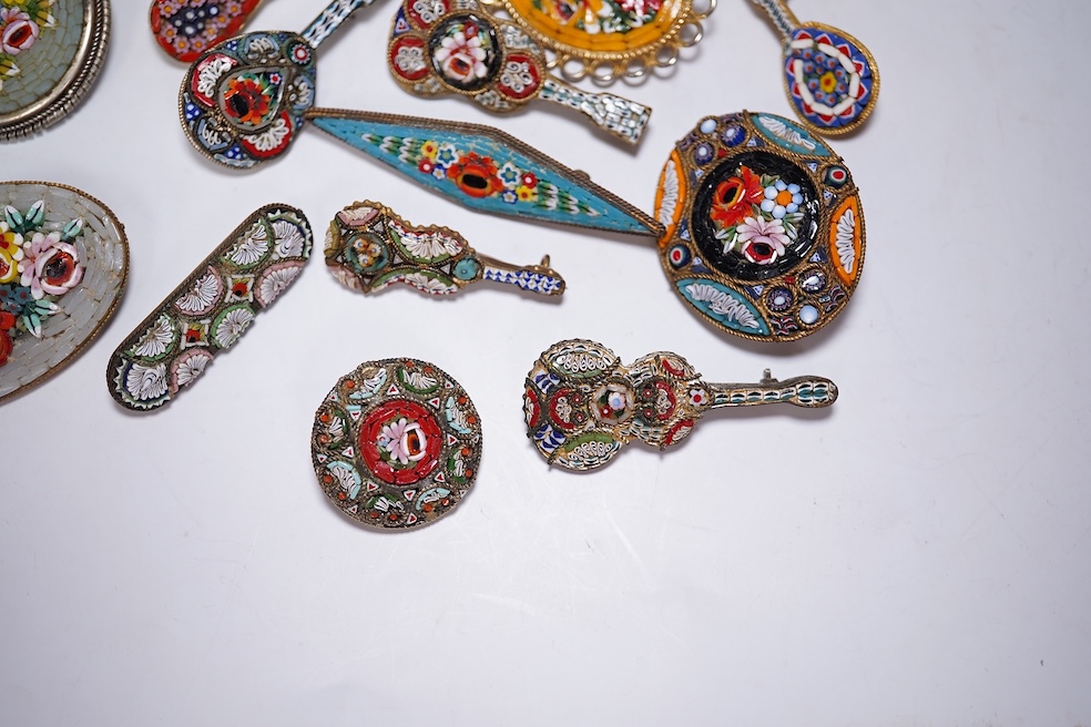 A collection of thirty-one micro-mosaic brooches, including fourteen mixed guitar and banjo shaped brooches, six large oval brooches and seven smaller brooches, three long brooches and a star shaped brooch. Condition - g